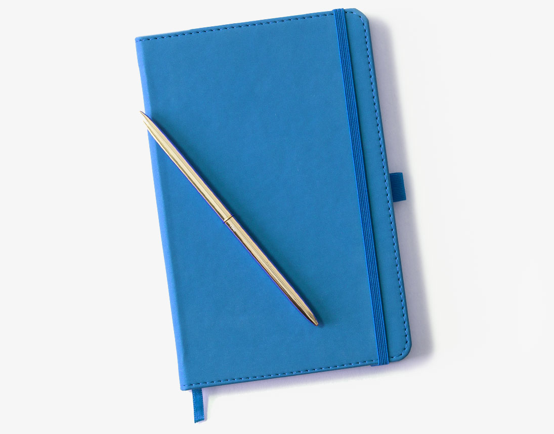 Blue faux leather notebook with a gold metal pen